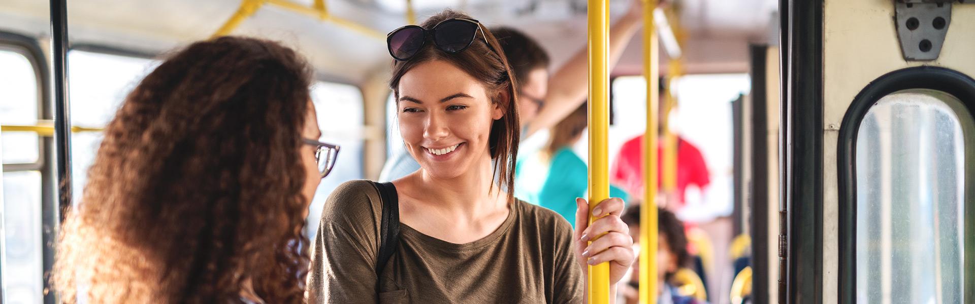 young students taking public transportation to college campus